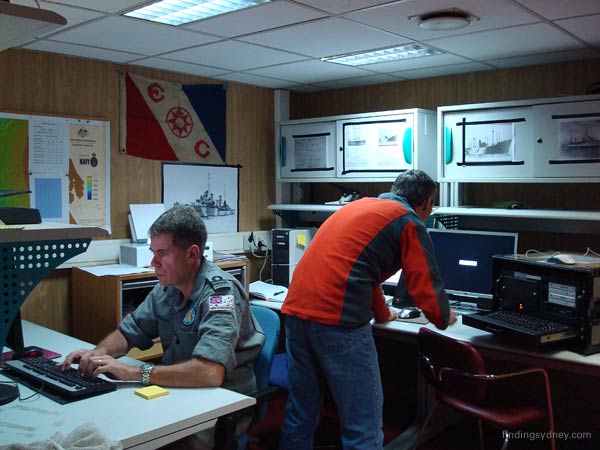 David Mearns and John Perryman working at their shared workspace.